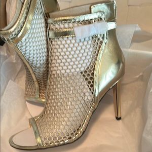 Brand new pair of Nine West IDIDIT2 gold booties.